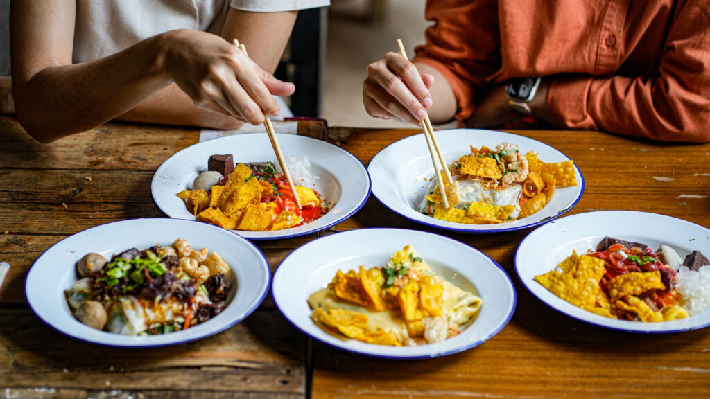 medium vecteezy young asian couple traveler tourists eating thai street food 66523927 medium